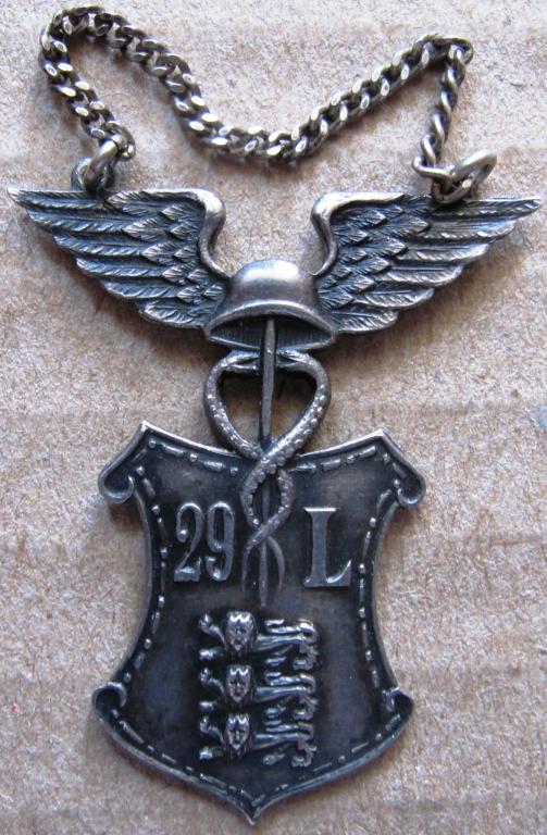 Коммерческое училище (школа). 29 L. Эстония 1950г. ромб