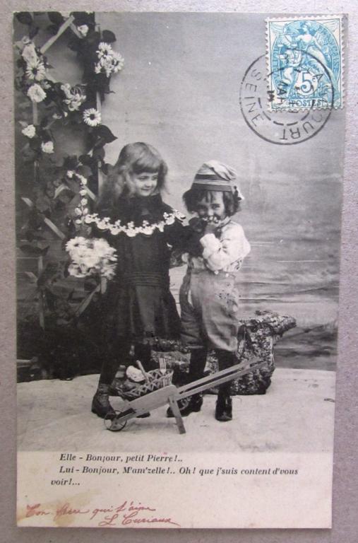 Маленький кавалер в колпаке целует ручку девочке Штемпель 1905