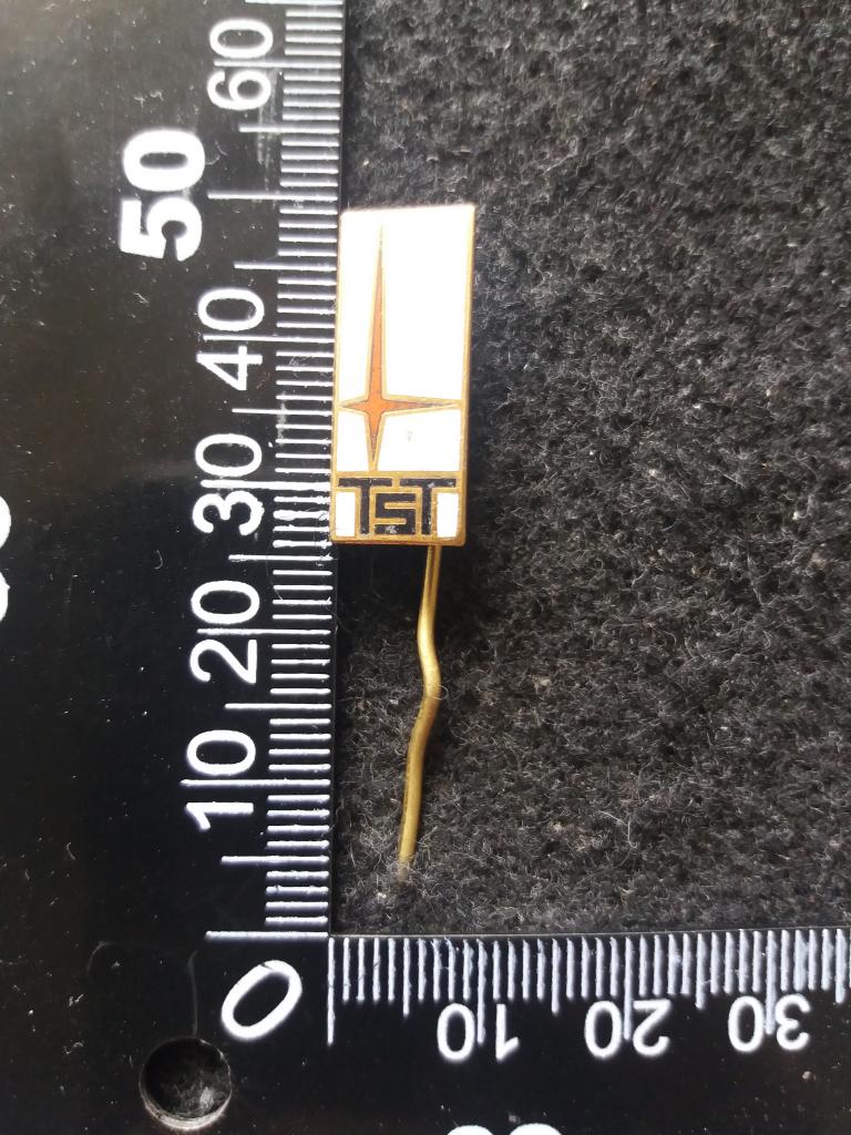 Знак "TST" (тур. фирма??, тяжёлый металл)