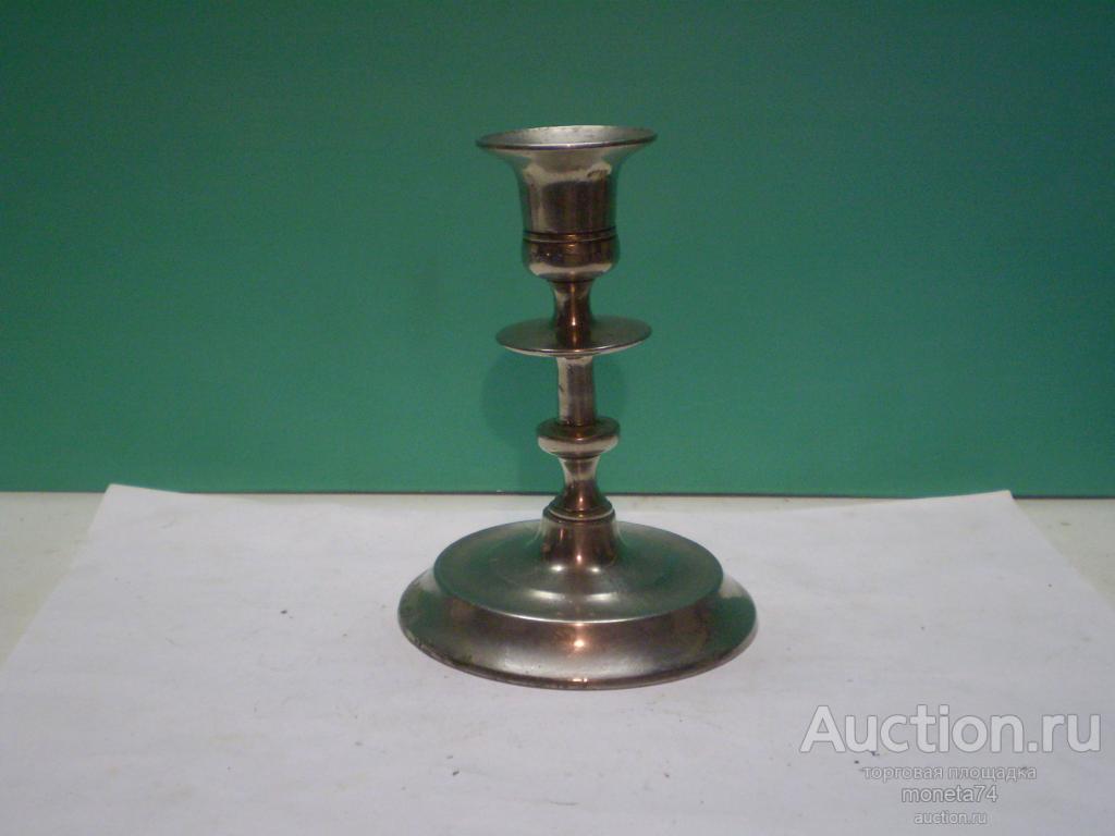 Старинный бронзовый никелированый подсвечник. Высота 13 см. Имеет небольшой наклон.