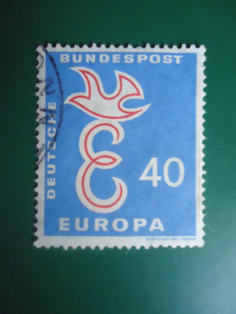 1958 г.  ФРГ    гаш. без клея  остатки конверта.