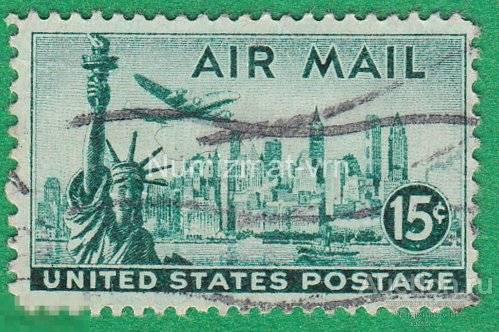 Марка США 1964 г. Самолет над городом. Статуя свободы. Авиапочта США.